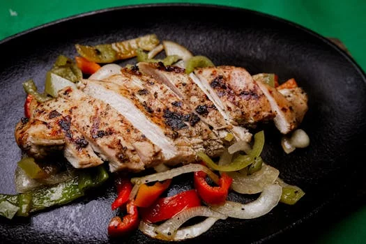 sizzling chicken fajitas with peppers onions